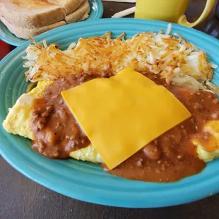 Chili cheese omelet w/ hash browns and sourdough toast