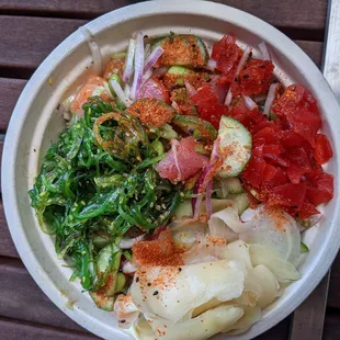 Poke bowl w/salmon and tuna. There&apos;s a little more fish hiding under all the toppings.