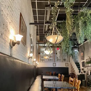 a dining area with a long table and chairs