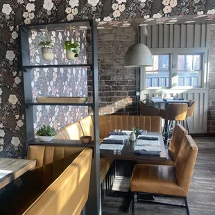 a dining area with a table and chairs