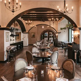 a dining room with tables and chairs