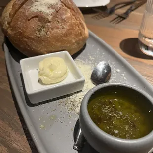 Bread, butter and olive oil with olives