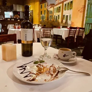 Finished my meal, enjoying an expresó with amazing soft delicious dessert. Moscato D' Asti for later.