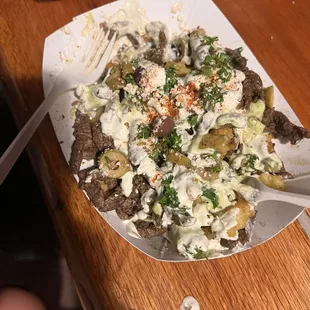 Loaded Greek fries with steak