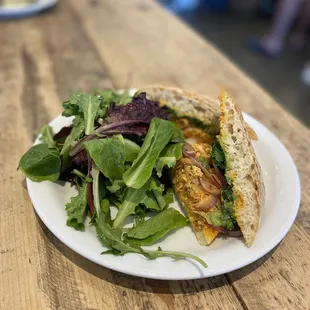 Spicy chicken sandwich with vinaigrette salad