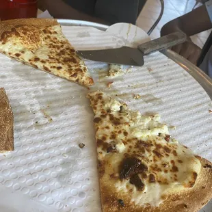 Feta, sun dried tomato, and garlic pizza with garlic bread