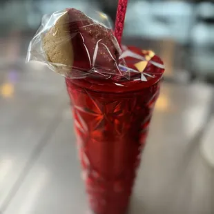 a red cup with a sandwich in it