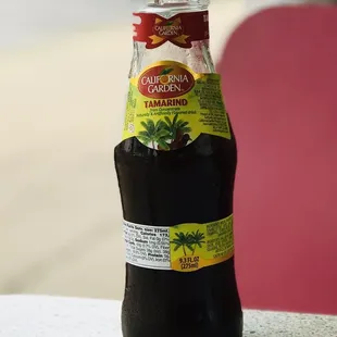 a bottle of soda on a table