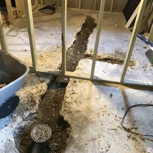 a hole in the floor with a drain