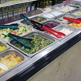 Salads, hummus, baba ganoush and canned fruits in syrup.