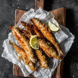 fried fish on a cutting board