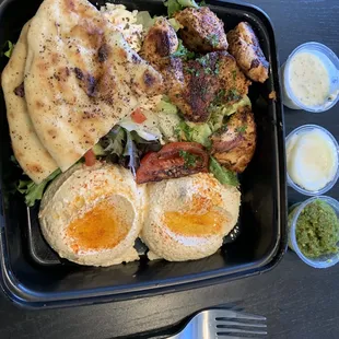 Seriously delicious chicken shish with hummus, bread and salad
