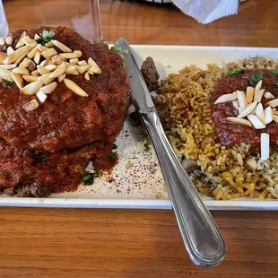 a plate of meat and rice