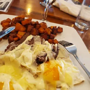 Perfect combination. Hash/fried potatoes, steak, eggs fried over easy.