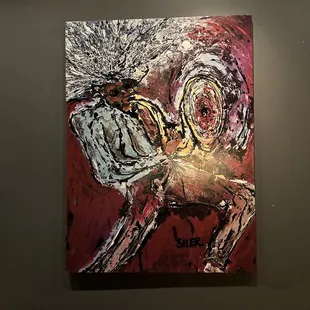 a painting of a horse on a wall