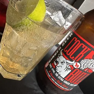 a glass of soda and a bottle of lemonade