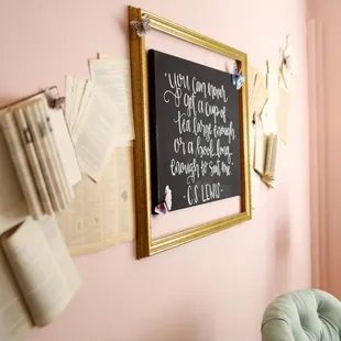 a chalkboard on a pink wall