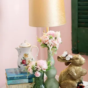 a table with books and a lamp