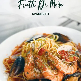 a plate of pasta with seafood and musselling