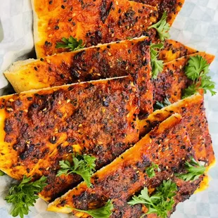 Flatbread Muhammarah with a beautiful green parsley and a cup of shay