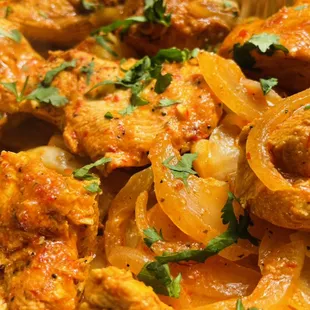 Syrian Spiced Chicken cooked with onion and potato.