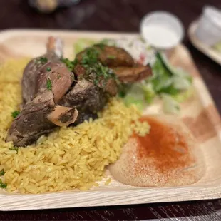 Lamb shank combo, hummus and pita bread, greek salad, greek potatoes