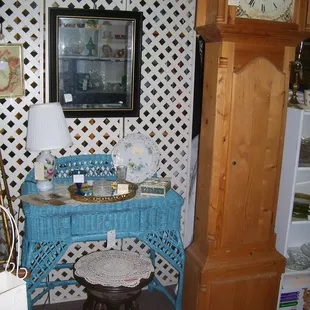 1930's era wicker desk/vanity, and modern grandfather clock