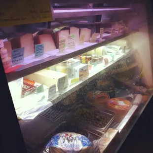 Deli case full of Jamon (cured ham) and Spanish cheeses and other delights!