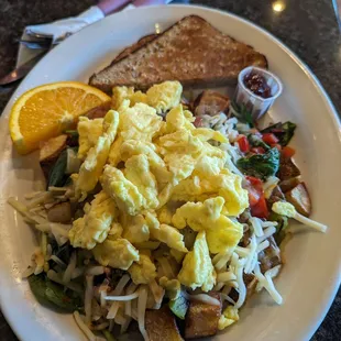Scrambled eggs, potato wedges, mushrooms