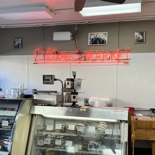 a neon sign above the counter