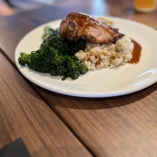 The Airline Chicken Breast was served on a bed of risotto with broccolini.