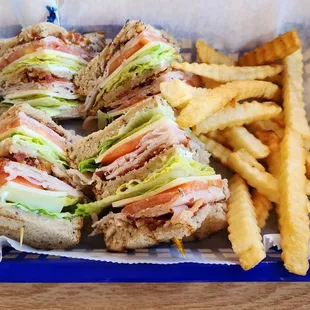 a club sandwich and french fries