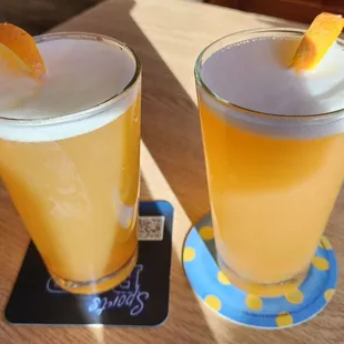 two glasses of orange juice