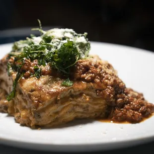 LASAGNA CLASSICA Homemade layer pasta with Bolognese sauce, bechamel crispy arugula