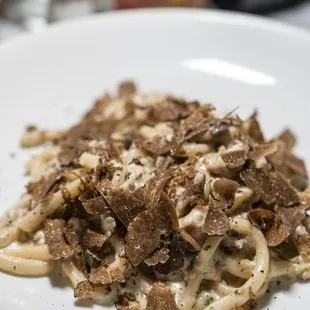 STROZZAPRETI ALLA NORCINA Homemade egg free pasta, pork sausage, porcini mushrooms, light cream, black truffle