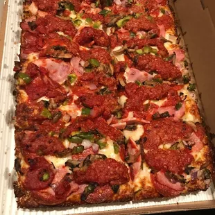 Large supreme, sauce on top and bottom