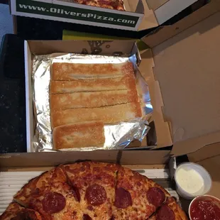 Current coupon deal- 2 large, 1 topping pizzas and Parmesan sticks $19.99