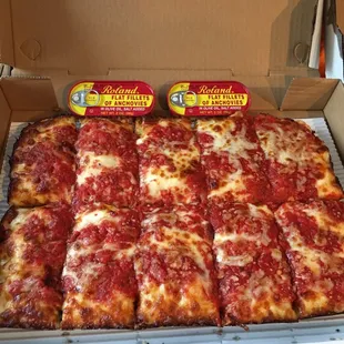 2 tins of anchovies with our large pizza- yah!