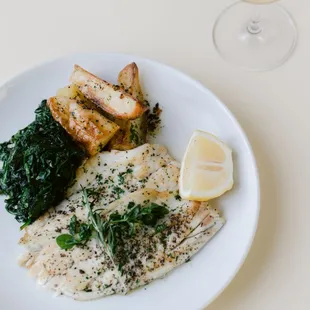 a plate of fish and vegetables