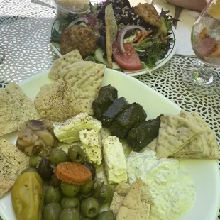 Salmon cakes over salad, and the mezede platter