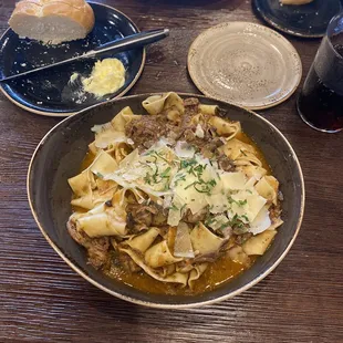 a bowl of pasta with meat and cheese