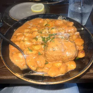 Gnocchi with vodka sauce and a meatball