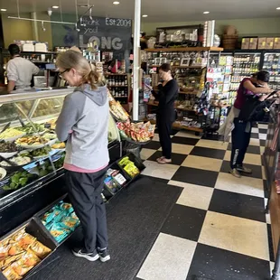 people shopping in a grocery store