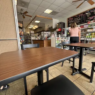 a woman standing at a table