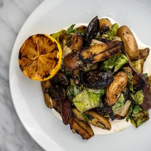 Grilled Weiser Potatoes w/ escarole, grilled lemon, and creme fraiche