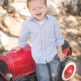 Children's portrait session with vintage toy car