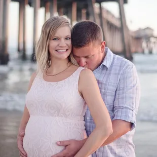 Maternity photoshoot at Huntington Beach Pier at sunset