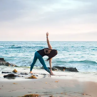 Laguna Beach Fishermans Cove doing yoga at the beach for portrait session
