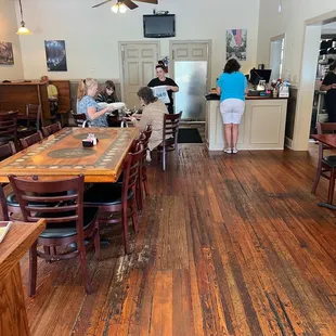 Look at those beautiful wooden floors! There&apos;s a nice distance between tables in this room.