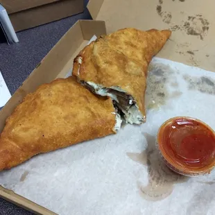 Gyro Calzone it was delicious! The crust isn&apos;t your ordinary crust it&apos;s light and flakey.
